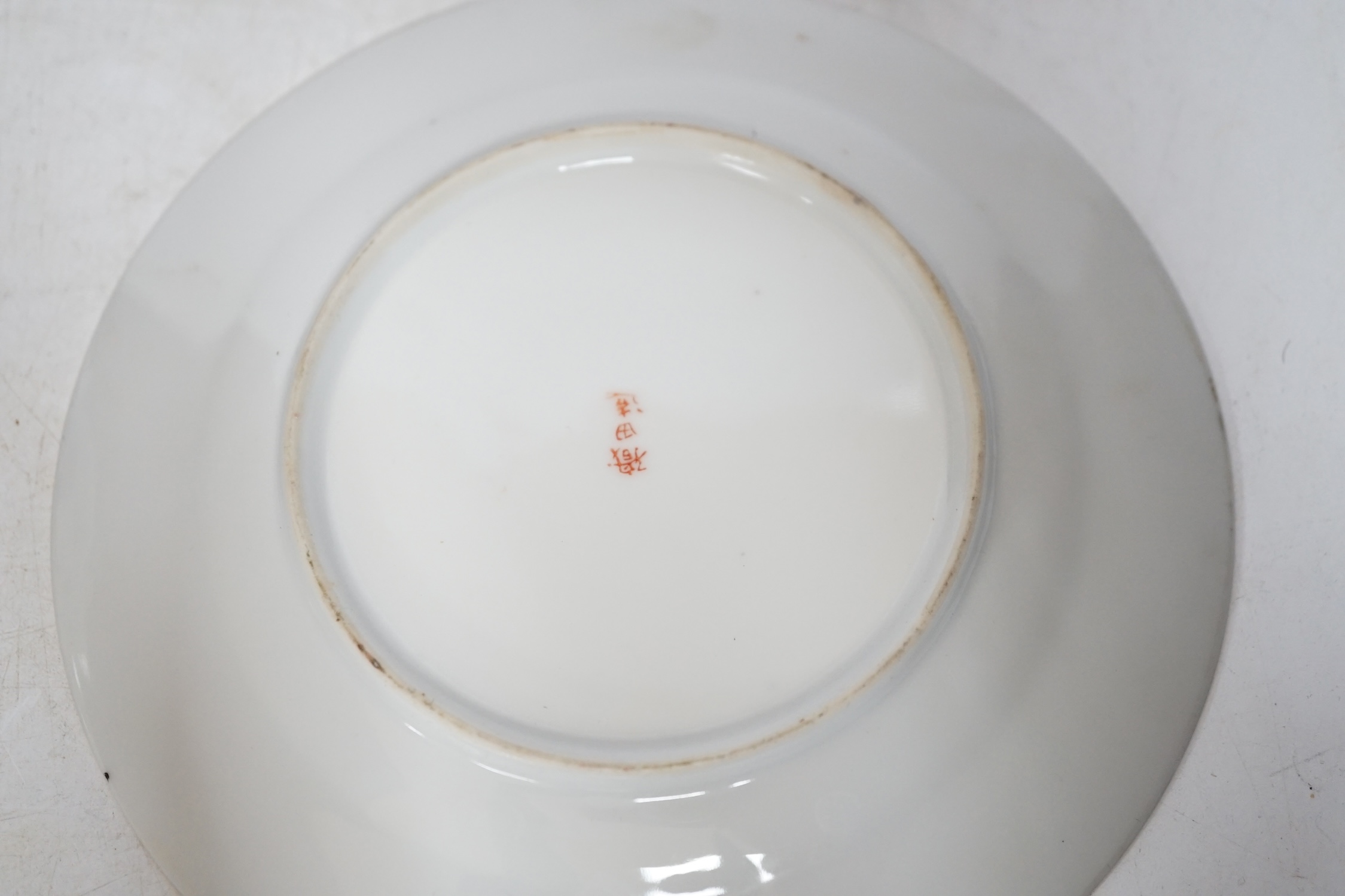 Four Chinese or Japanese porcelain saucers, largest 16.5 cm diameter